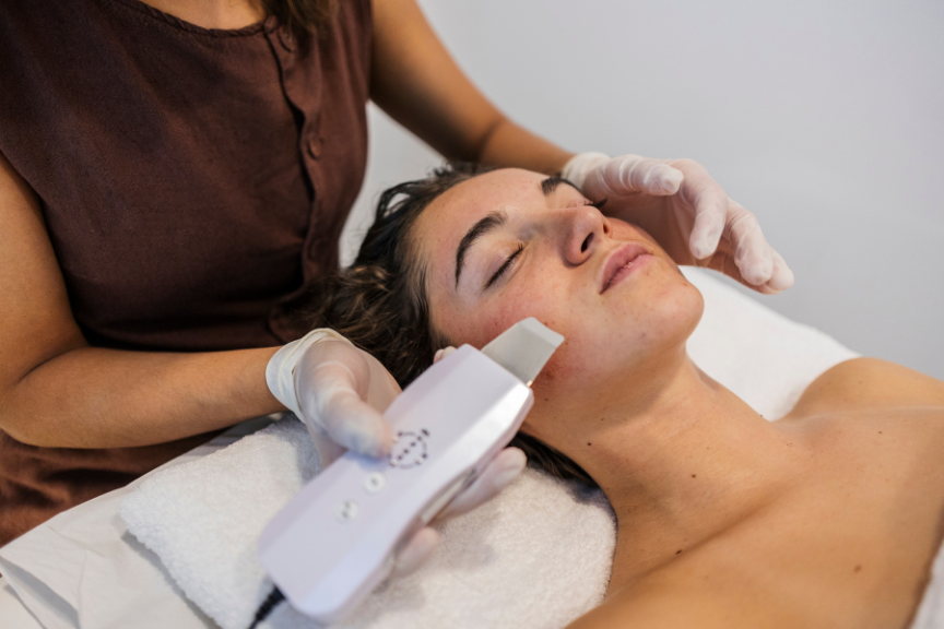 A woman receiving treatment from an esthetician in Washington, DC